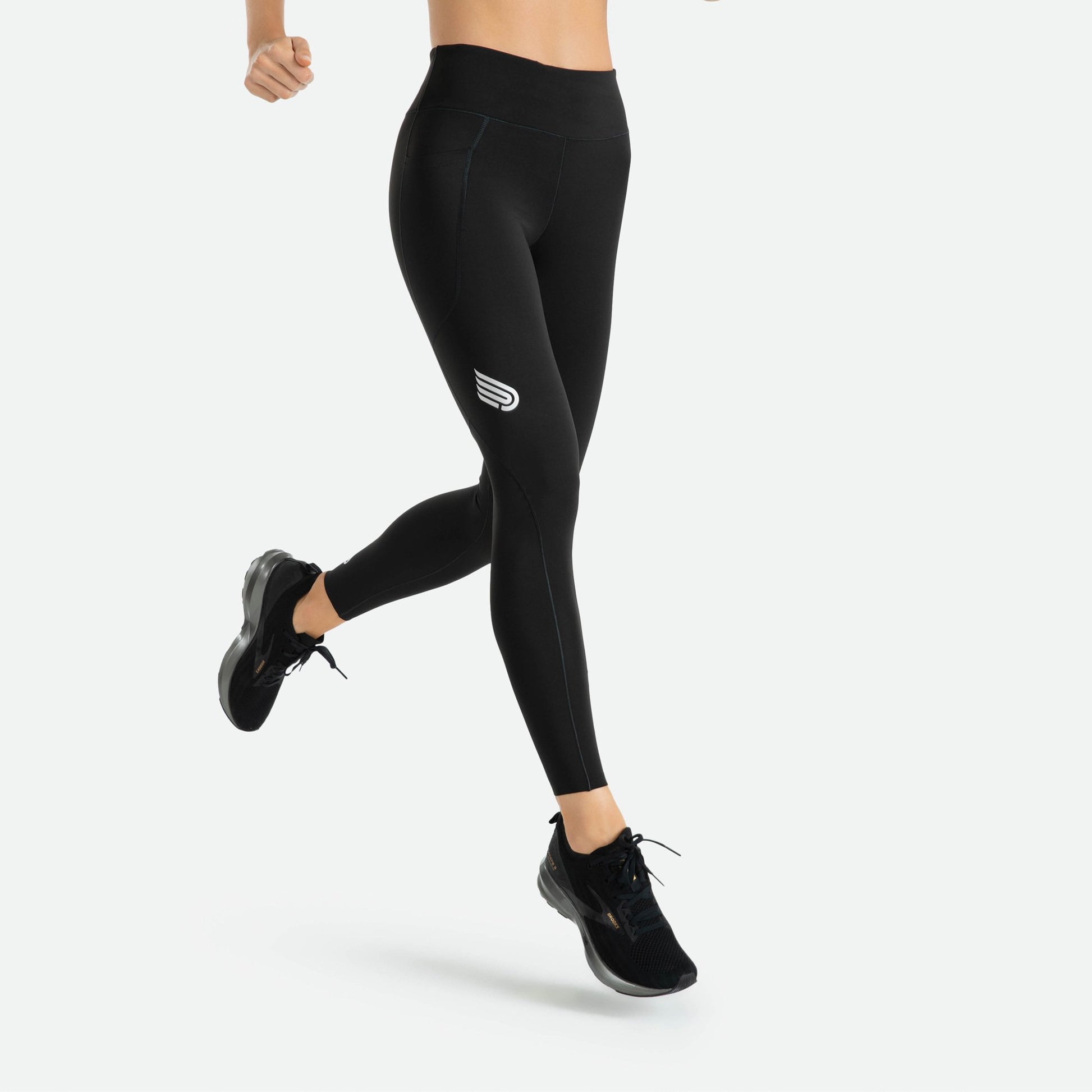 Pressio thermal tights for dame i fargen svart. Mid-rise. På modell fra siden og foran. 